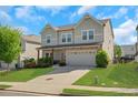 Beautiful two-story home boasts a manicured lawn and welcoming curb appeal at 5751 Green Arbor Way, Sugar Hill, GA 30518