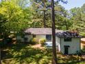 Backyard of the house with the grassy lawn at 2704 Terratim Ln, Decatur, GA 30034