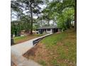 View of the front yard with the long driveway to the house at 2704 Terratim Ln, Decatur, GA 30034