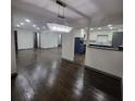Spacious living room with hardwood floors and recessed lighting, flowing into an open kitchen area at 2704 Terratim Ln, Decatur, GA 30034