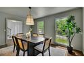 Dining room featuring a modern table, chairs, and plenty of natural light at 1430 Dallas Circle Sw, Marietta, GA 30064