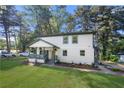 Charming two-story home with a welcoming front porch and a freshly landscaped front yard at 2111 Holly Hill Dr, Decatur, GA 30032