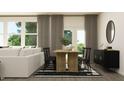 Contemporary dining room with a rustic wooden table, black chairs, and modern decor at 2425 Livi Ln, Buford, GA 30519
