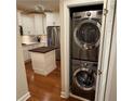 Convenient laundry closet with stackable washer and dryer units located near a modern kitchen at 3047 Lenox Ne Rd # 2105, Atlanta, GA 30324