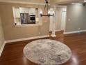 Living room with hardwood floors, neutral colors, and open to the kitchen at 3047 Lenox Ne Rd # 2105, Atlanta, GA 30324