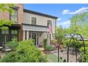 Beautiful home featuring well-maintained landscaping and an inviting front patio at 727 Hammond Dr, Woodstock, GA 30188