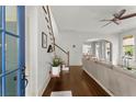 Bright foyer with hardwood floors, stairs, and an open view into the spacious living area at 727 Hammond Dr, Woodstock, GA 30188