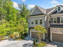 Charming two-story home with manicured landscaping, offers curb appeal and convenience with a spacious two-car garage at 2166 Sonoma Se Dr, Smyrna, GA 30080