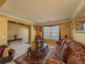 Cozy living room with plush seating, natural light, and a warm color palette at 2775 Storybook Ct, Grayson, GA 30017
