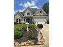 Charming gray two-story home with manicured landscaping and stone accents at 280 Ridge Bluff Ln, Suwanee, GA 30024