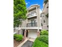 Inviting townhome with a two-car garage, manicured landscaping and private balconies at 4254 River Green Nw Dr # 612, Atlanta, GA 30327