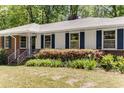 Detailed view of the home's exterior with well-maintained landscaping and classic architectural details at 2357 Burnt Creek Rd, Decatur, GA 30033