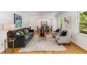 Bright living room with hardwood floors, neutral decor, and elegant furnishings at 2357 Burnt Creek Rd, Decatur, GA 30033