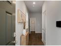 Clean entryway featuring hardwood floors, neutral walls, and stylish decor accents at 4422 Richmond Se Ct, Stone Mountain, GA 30083
