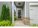 Inviting front porch with decorative pillars, lush greenery, and a welcoming entrance at 4422 Richmond Se Ct, Stone Mountain, GA 30083
