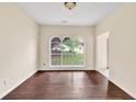 Elegant dining room featuring dark wood floors and an arched window at 7737 Bar Harbor Dr, Riverdale, GA 30296