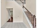 Bright foyer showcasing staircase with wood treads and white risers at 7737 Bar Harbor Dr, Riverdale, GA 30296
