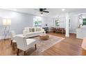Bright, open-concept living room featuring hardwood floors, neutral tones, and contemporary furnishings at 808 Casplan Sw St, Atlanta, GA 30310