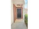 Inviting front door entrance with brick accents and stylish overhead lighting at 5465 Mountain Top Pl, Cumming, GA 30041