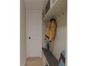 Mudroom featuring a coat rack, shelving, and a bench for added convenience and organization at 328 Treble Way, Alpharetta, GA 30009