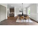Elegant dining room with hardwood floors and natural light, perfect for Gathering gatherings at 1827 Shaker Falls Ln, Lawrenceville, GA 30045