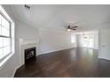 Spacious living room featuring a fireplace, hardwood floors, and ample natural light at 2980 Porsche Nw Pl, Kennesaw, GA 30144
