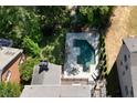Aerial view of backyard featuring pool and patio perfect for lounging and entertaining at 3003 W Roxboro Rd, Atlanta, GA 30324