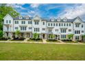 Beautiful townhomes feature well-maintained lawns and tidy landscaping, enhancing the community's aesthetic at 2062 Cortland Rd, Milton, GA 30009