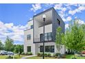 Striking exterior of a modern home showcasing a balcony, fresh landscaping and beautiful architectural design at 326 Treble Way, Alpharetta, GA 30009