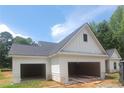 Spacious three-car garage with ample parking and easy access to the home's exterior at 877 Highway 101 N, Dallas, GA 30157