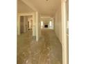 Open-concept hallway leading to a living space with a fireplace and abundant natural light at 877 Highway 101 N, Dallas, GA 30157