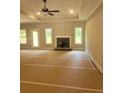 A cozy living room features a fireplace, recessed lighting, and large windows at 877 Highway 101 N, Dallas, GA 30157