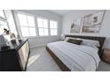 Bright bedroom with a comfortable bed, dresser, and large windows offering natural light at 439 Mezzo Ln # 88, Alpharetta, GA 30009
