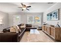 Bright living room boasts natural light, comfortable seating, and a stylish entertainment center at 2171 Plantation Ln, Chamblee, GA 30341