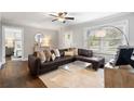 Inviting living room with hardwood floors, neutral decor, and a cozy couch facing an open hallway at 2171 Plantation Ln, Chamblee, GA 30341