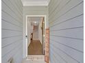 Inviting entryway with a wooden welcome sign, leading to hardwood floors and a staircase at 360 Niles Ct, Marietta, GA 30060