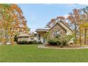 Well-maintained home with stone accents, lush lawn and beautiful fall foliage at 7840 Highway 101, Rockmart, GA 30153