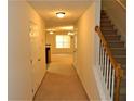 Inviting hallway with staircase leads to spacious living areas at 615 Magnolia Gardens Walk, Mcdonough, GA 30253