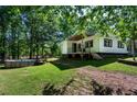 The backyard features a partially above ground swimming pool, and wooden patio at 1369 N Highway 16, Whitesburg, GA 30185