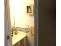 Cozy half bath, with a clean sink and delightful lighthouse themed decor at 1920 Stancrest Nw Trce, Kennesaw, GA 30152