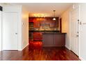 Open concept kitchen with stainless steel appliances, granite countertops, and dark wood cabinetry at 2657 Lenox Ne Rd # 68 Bld, Atlanta, GA 30324