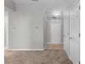 Inviting entryway with tile flooring and neutral wall color, offering a clean and modern aesthetic at 6416 Chestnut Glen Dr, Norcross, GA 30071