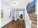 Bright foyer with hardwood floors leads to the staircase and living spaces, creating a welcoming entrance at 664 Somerset Dr, Lawrenceville, GA 30046