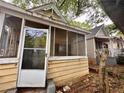 View of a cozy front porch of a home, showing architectural details and proximity to neighboring houses at 712 Garibaldi Sw St, Atlanta, GA 30310