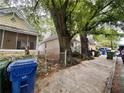 A street view showcasing cozy homes with colorful facades, green foliage, and sidewalks in a residential area at 712 Garibaldi Sw St, Atlanta, GA 30310