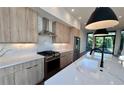 Bright kitchen featuring stainless steel appliances, marble countertops, and stylish light fixtures at 105 Georgia Se Ave # 6, Atlanta, GA 30312