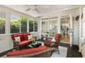 Bright sunroom with cozy wicker furnishings and lots of windows for natural light at 1000 Stethem Fry, Johns Creek, GA 30022