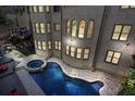 Aerial view of a luxurious swimming pool, jacuzzi, outdoor seating and backyard deck at 2015 Shaudi Ln, Atlanta, GA 30345