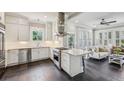 Modern kitchen featuring stainless steel appliances, a central island, and sleek dark floors at 933 N Highland Ne Ave, Atlanta, GA 30306