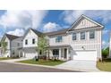 Street view of new construction homes with charming exteriors, garages, and manicured lawns at 1510 Gatekeeper Ter, Marietta, GA 30066